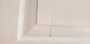 Example of outdated shaker-style kitchen doors with brush marks and uneven paint finish