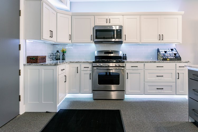 View of the Kitchen Refresh Rochester design studio entry with product displays and design inspiration.