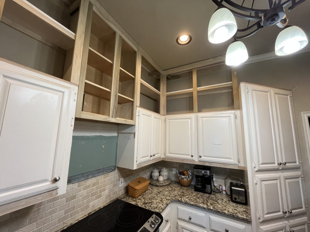 Kitchen mid-refresh with old cabinet doors removed and ready for new door and drawer front installation