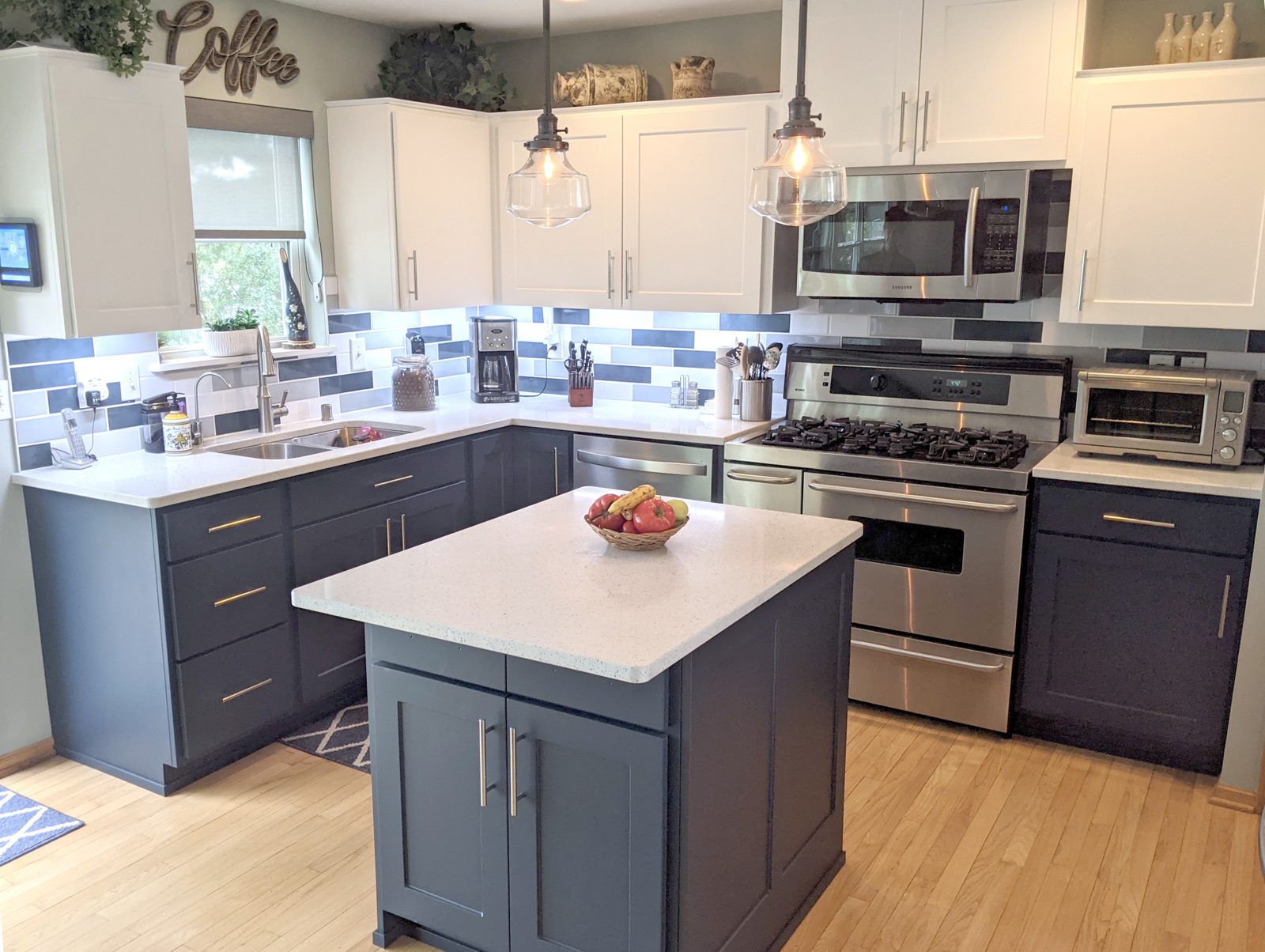 Two-tone kitchen cabinet refresh with white upper and navy lower thermofoil cabinet doors
