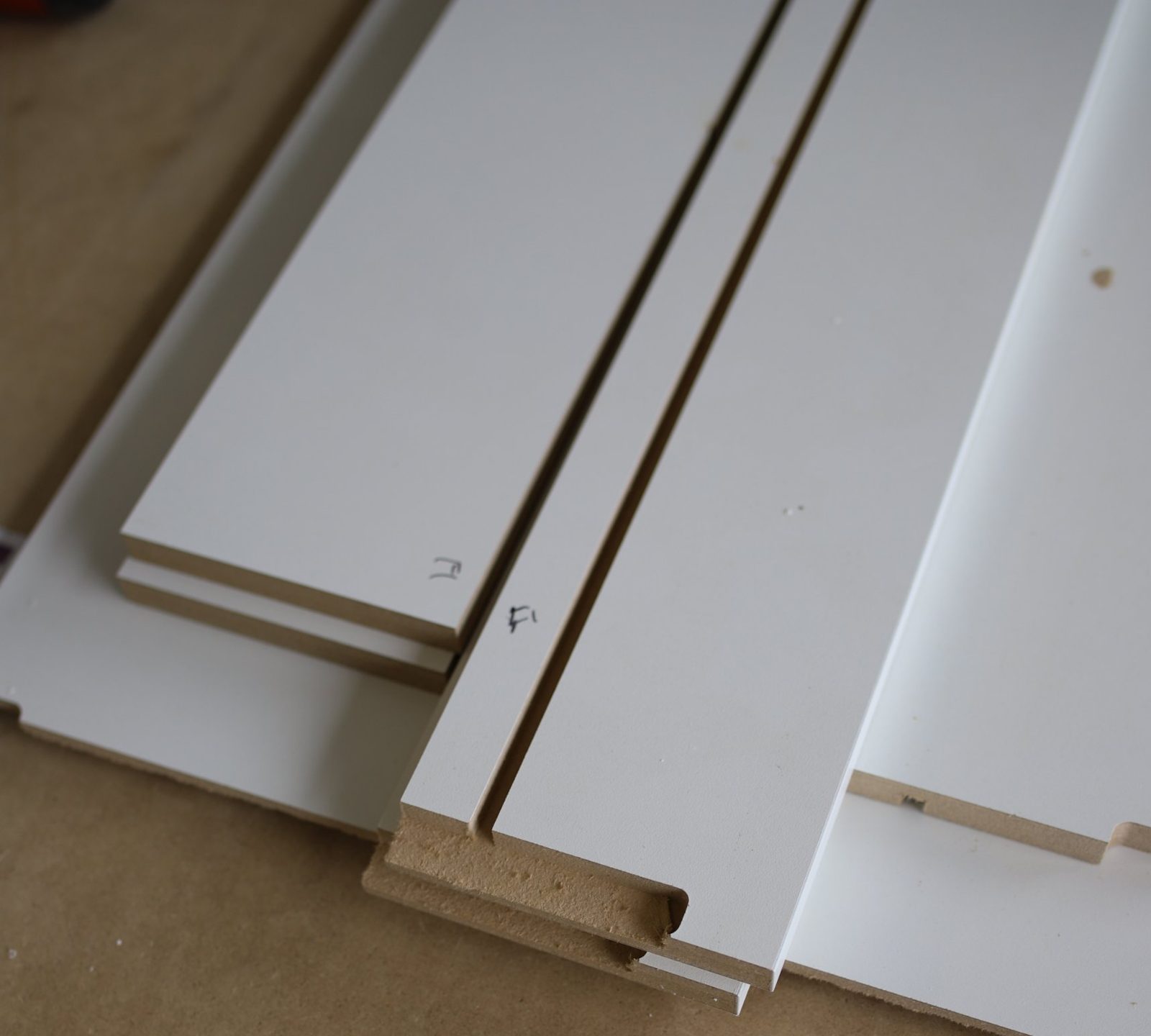 White thermofoil drawer fronts with a consistent color and finish across every piece